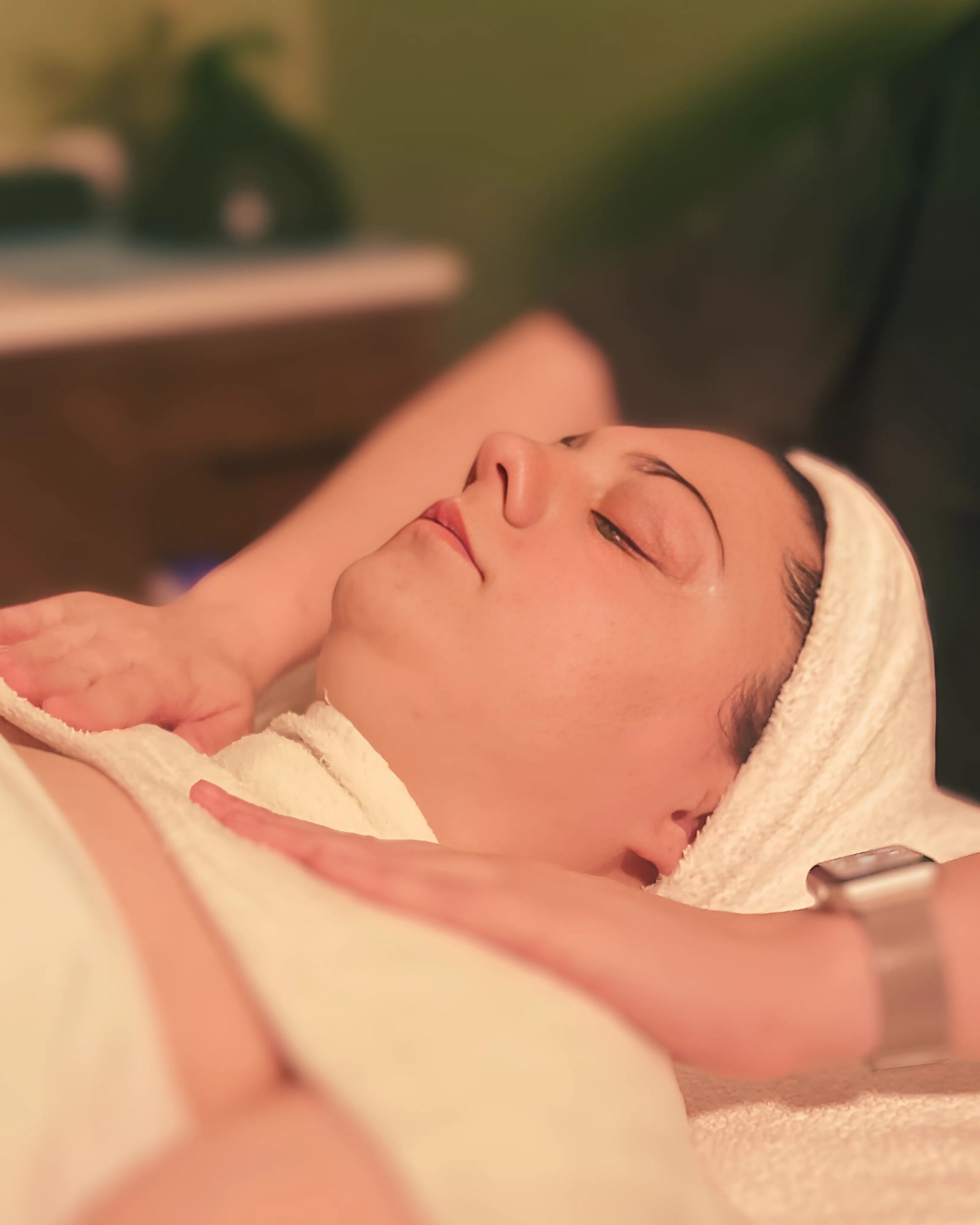 Women relaxing during facial 